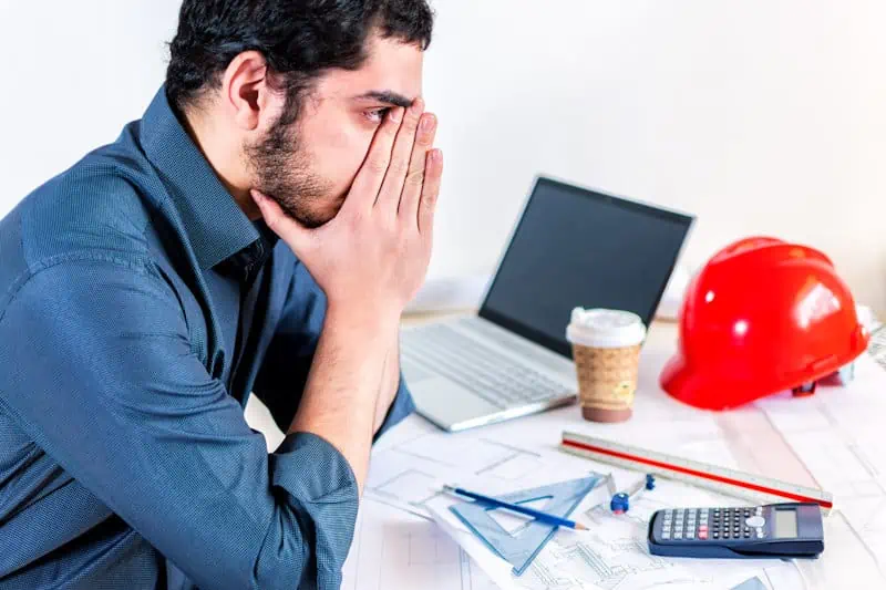 frustrated-caucasian-engineer-working-at-computer